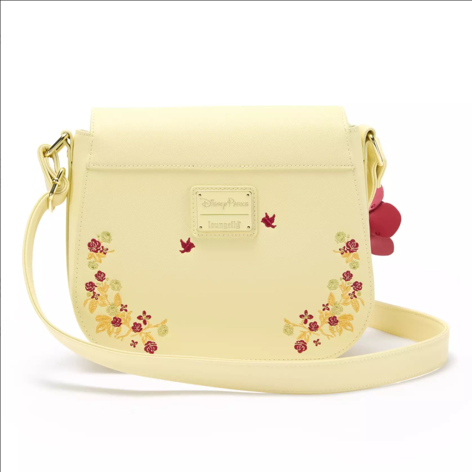 Yellow crossbody bag with floral embroidery and a visible brand logo on a white background