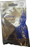 Packaged Disney Hidden Mystery plush toy with castle design on clear background