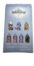 Collection of collectible pins with a box labeled 'Collect Them All' on a light background