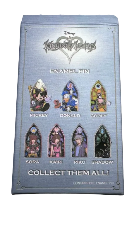 Collection of collectible pins with a box labeled 'Collect Them All' on a light background