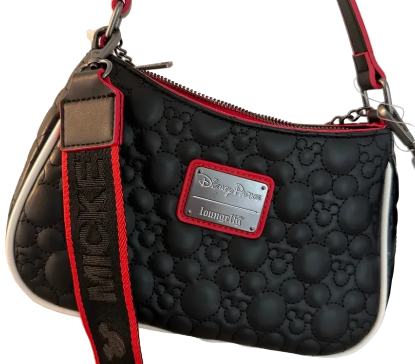 Black textured handbag with red accents and a Disney label on a white background