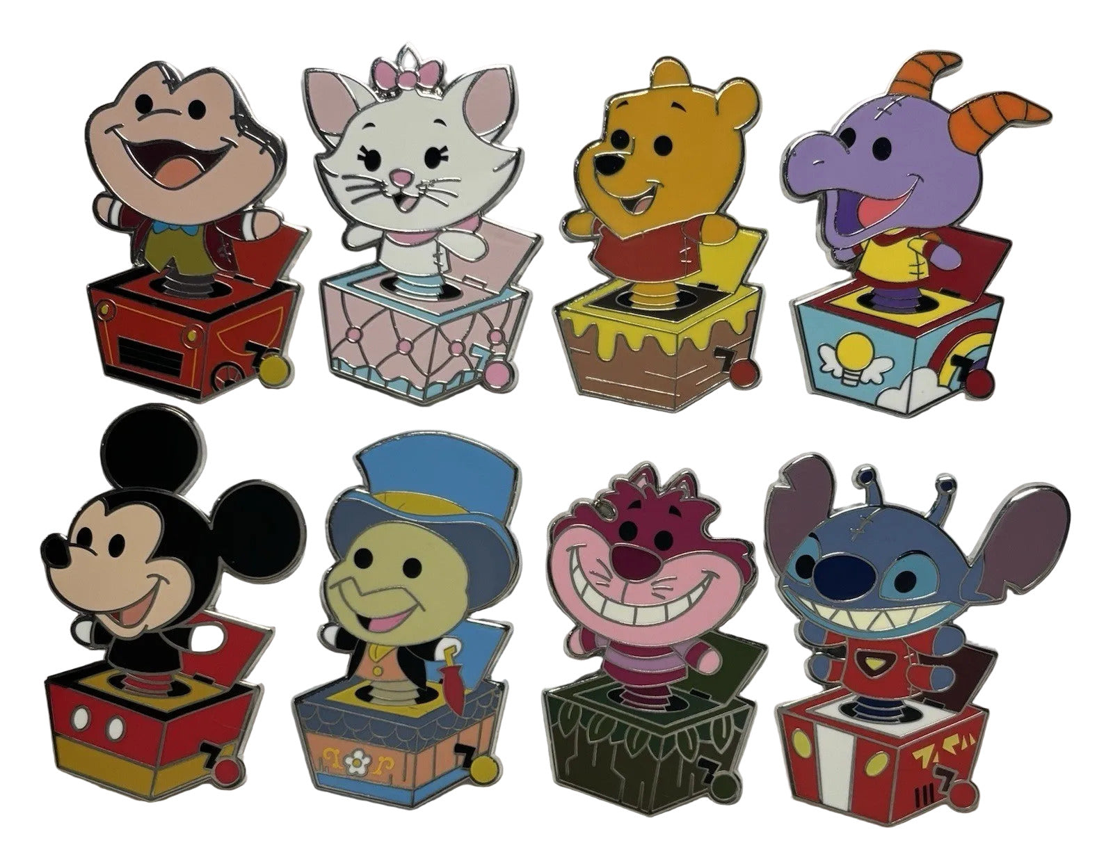 Set of colorful cartoon character jack-in-the-box toys on a light gray background