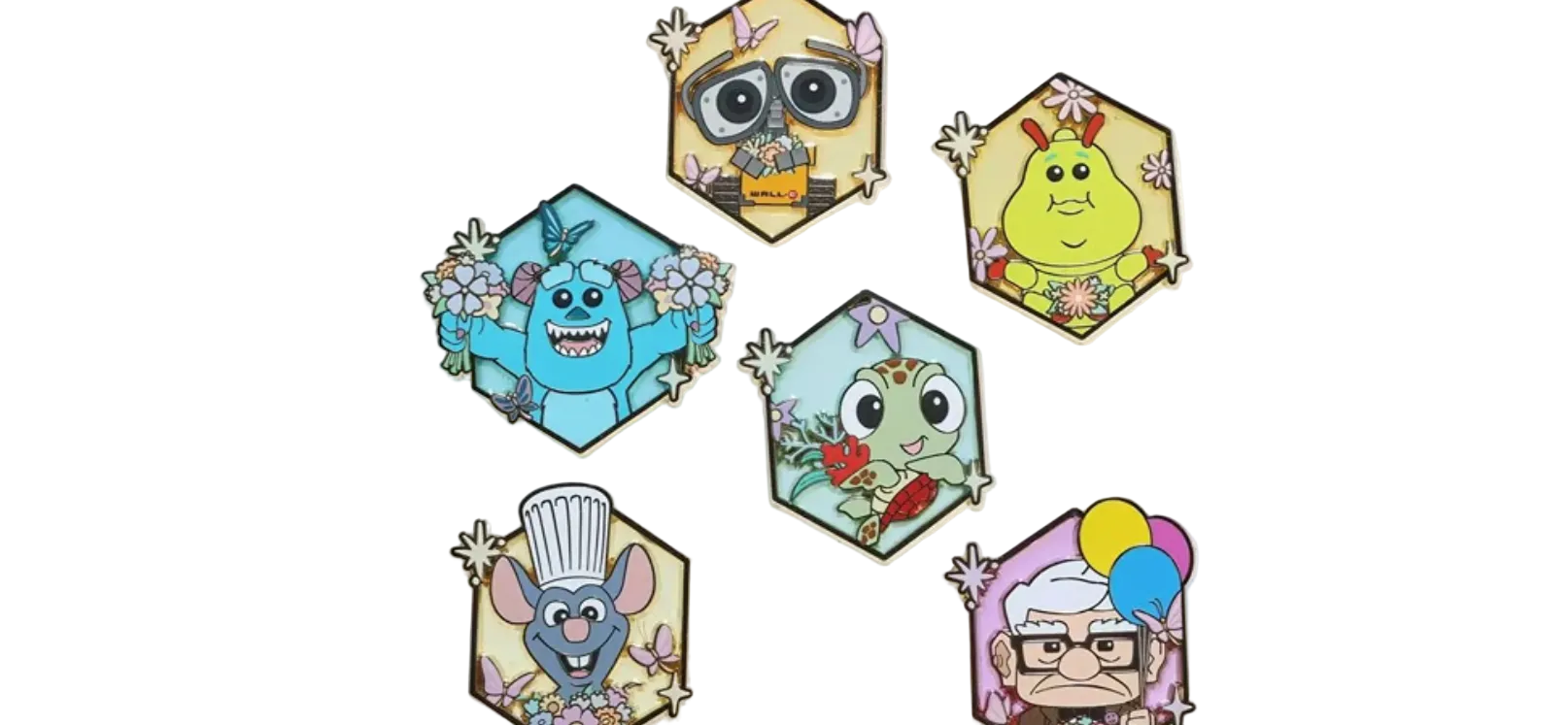 Set of colorful cartoon character pins on a white background