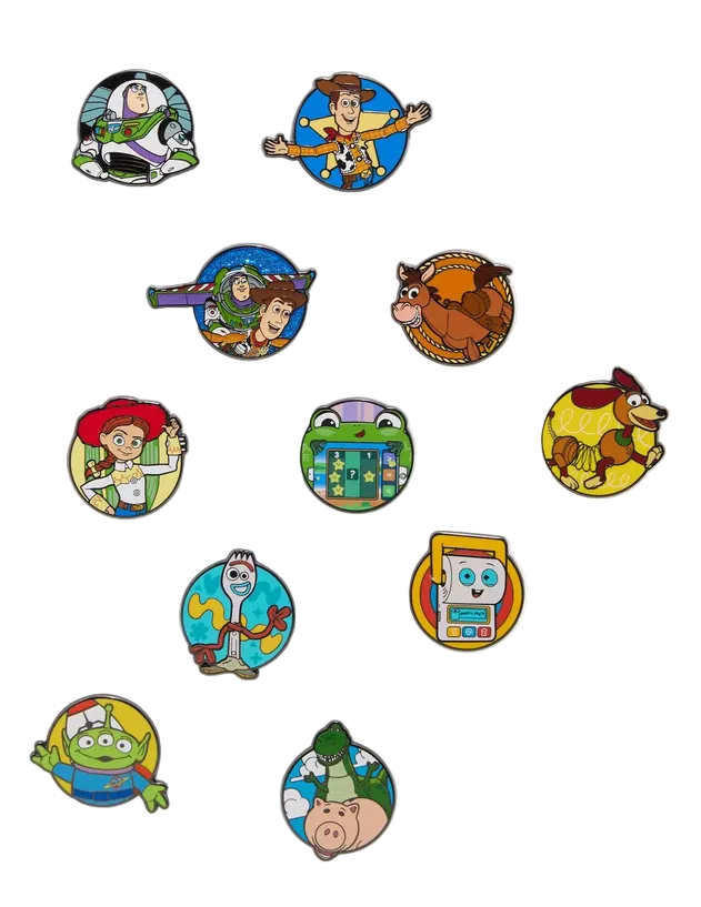 Set of colorful character pins from Toy Story on a white background