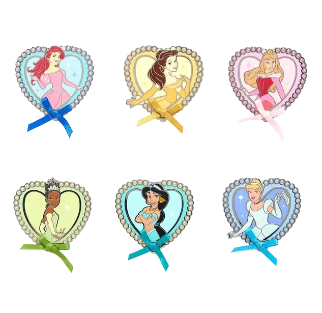 Set of six heart-shaped Disney princess brooches on a white background