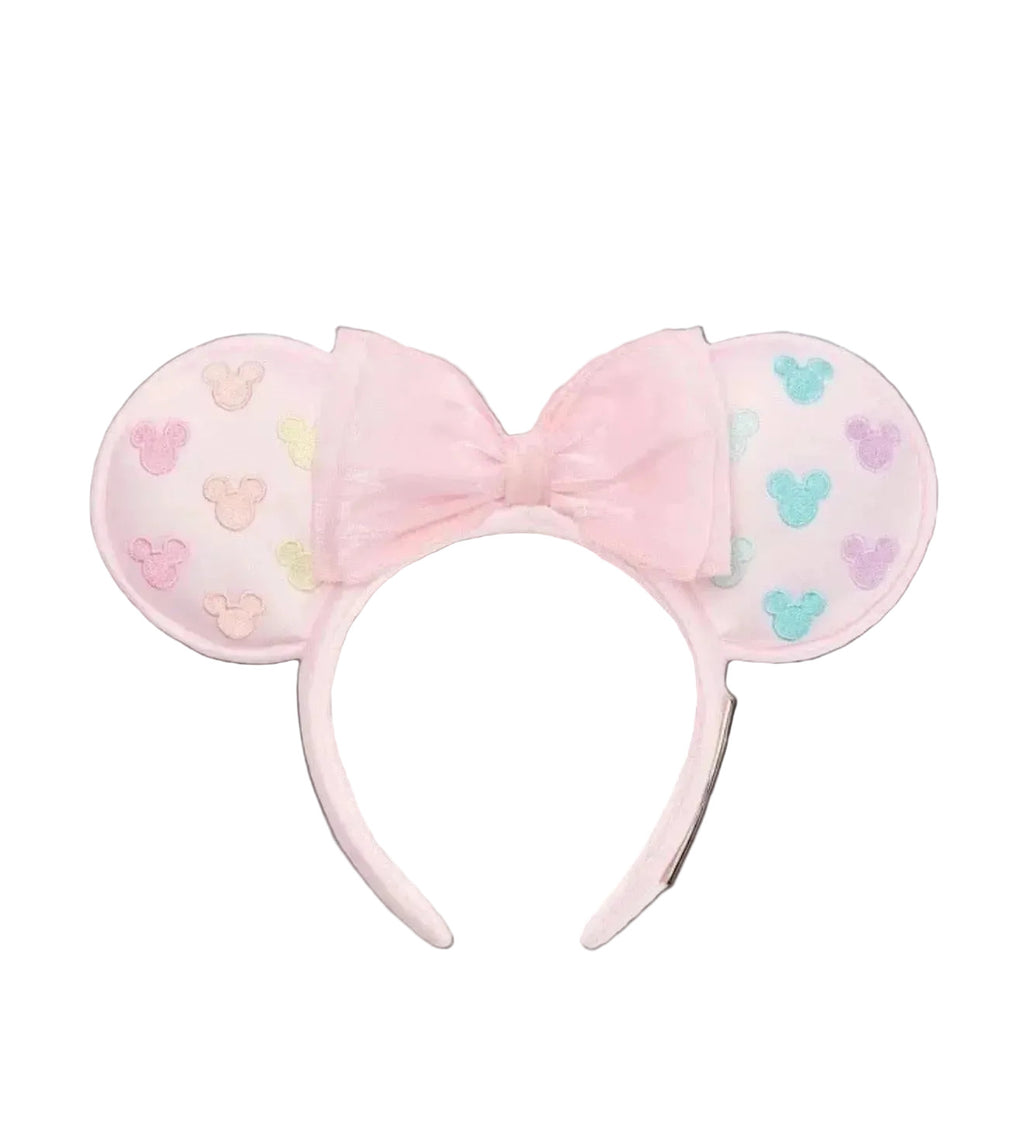 Pink mouse ears headband with colorful heart patterns on a white background