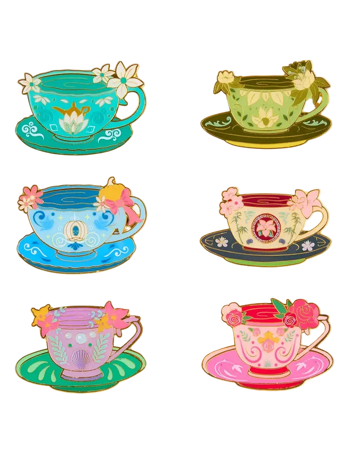 Set of colorful teacup and saucer pins on a white background