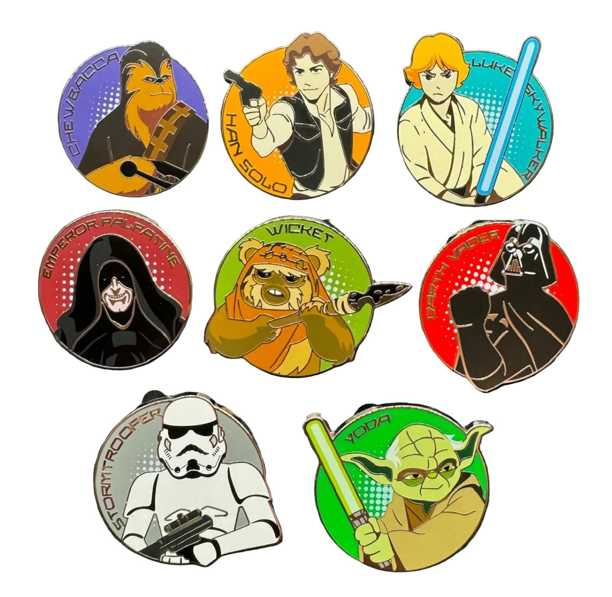 Set of Star Wars-themed pins featuring various characters on a dark background